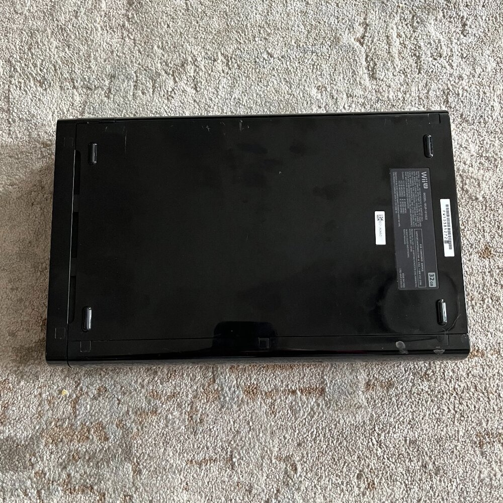 Nintendo Wii U console with original Wii U GamePad.